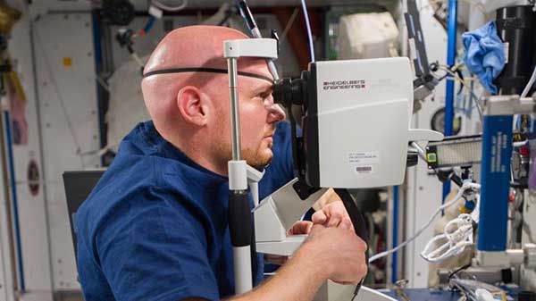 An astronaut on board the ISS having his eye examined with SPECTRALIS.