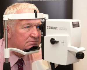 MP Sir Mike Penning sitting in front of a SPECTRALIS