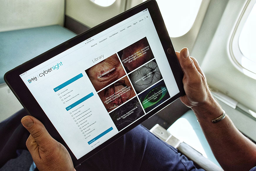 Dr Daniel Neely, Senior Medical Consultant for Cybersight, Orbis’s award-winning telemedicine and e-learning platform, demonstrates the service onboard the Orbis Flying Eye Hospital